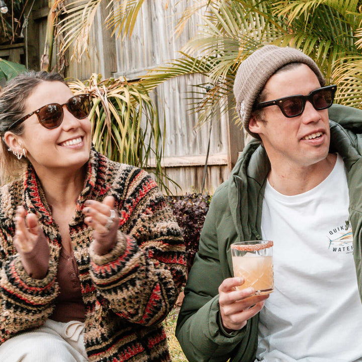 Two people drinking margaritas