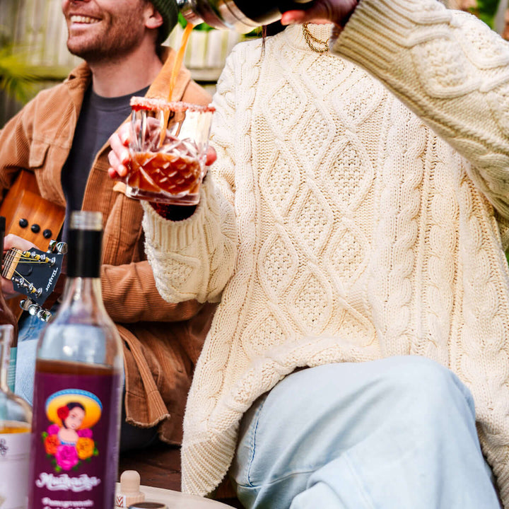 Lady doing a muchacha  pomegranate margarita 